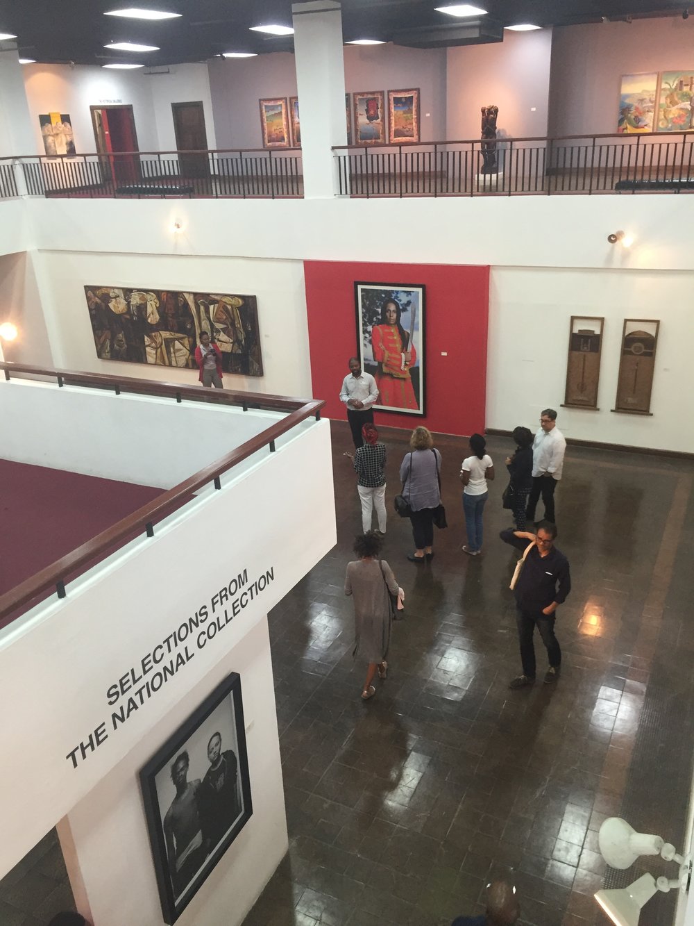 Interior view with tour group at National Art Gallery of Jamaica.